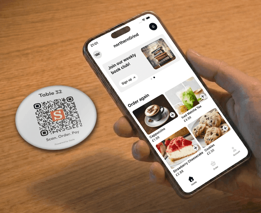 Customer ordering from a Sizzle app at a café table