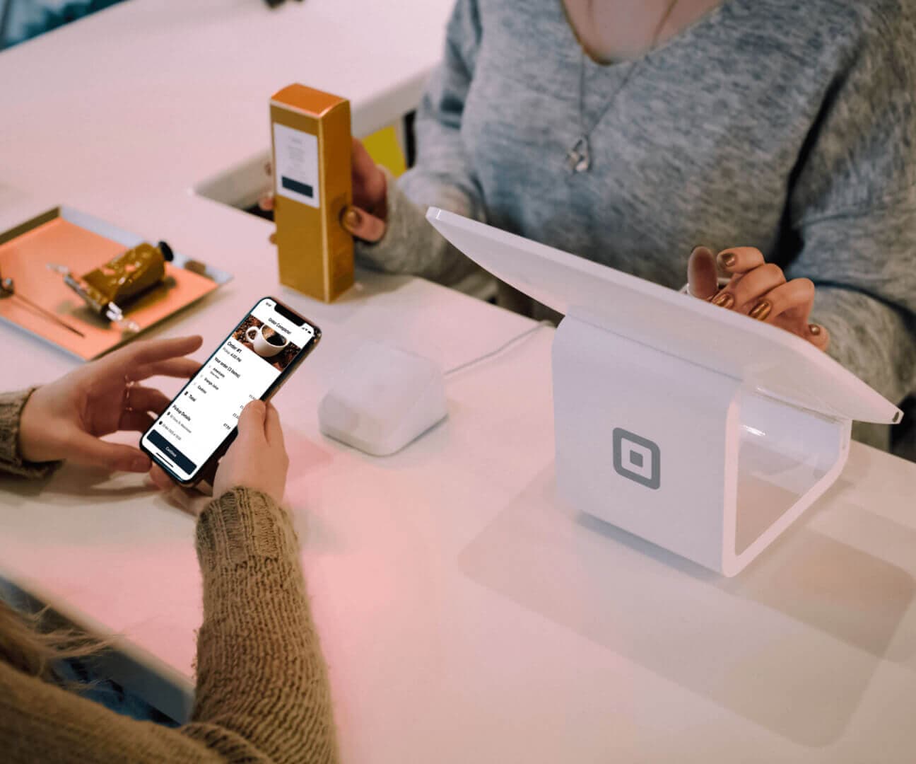 Square POS terminal on a café counter